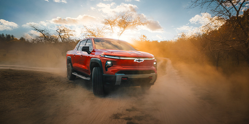 New 2026 Red Chevrolet Silverado EV showing its off-road capabilities