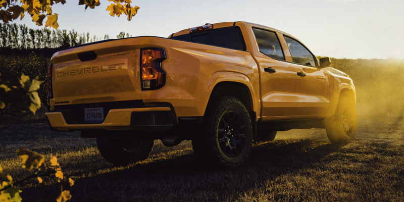 Yellow 2026 Chevrolet Colorado in it's low back side profile