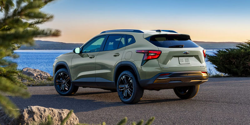 Light Green 2026 Chevy Trax parked in it's back side profile near sea